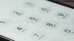 Man dial Spanish phone number, smartphone, cell phone, country code. Finger press a button, white background. High quality studio shot, close up, macro. - Powered by Shutterstock - Get 15% off with code: PIKWIZARD15