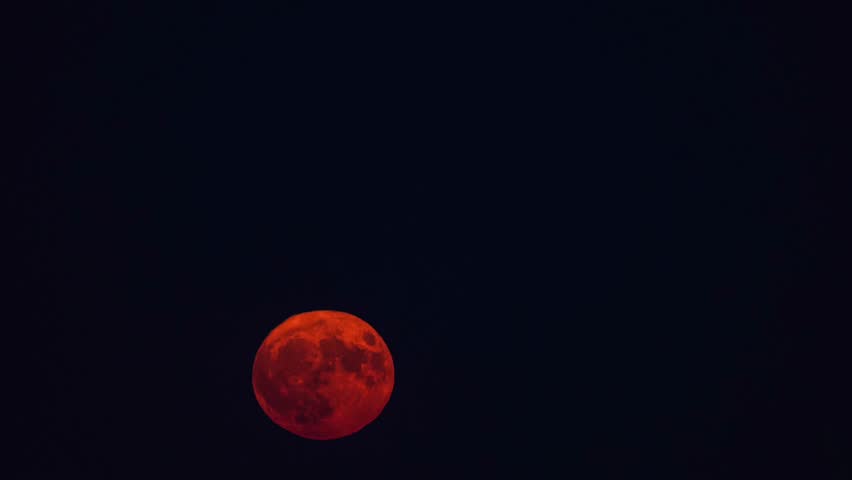 Sturgeon super moon sunrise. 4k video time lapse with super moon rising during 1st August 2023 evening, the only month with two full moons. Astronomy moon concept video.