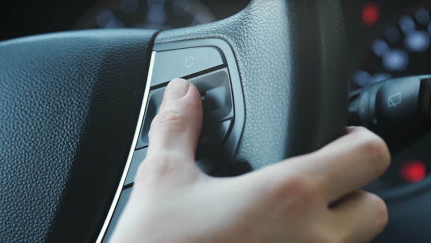 Car Driver Pressing Buttons On Steering Wheel, Woman Switching Buttons | Shutterstock HD Video #1106913087