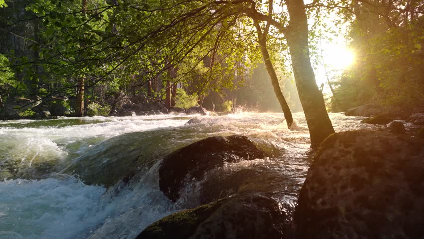 River Rapids in the Merced River as it runs through Yosemite National Park in California. Slow Motion.