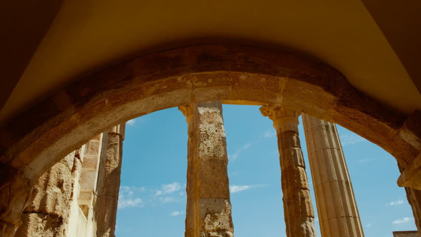 Temple of Diana, Merida, Extremadura, Spain, dating to 1 BC, majestic Roman relic standing tall, epitomizing historic grandeur amid modern urban life
