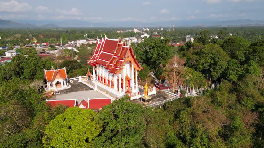 Drone aerial view of Wat Khao Bot a Theravada buddhist temple located in Bang Saphan, Prachuab Khiri Khan, Thailand. Royalty-Free Stock Footage #1106915659
