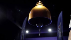 A boxing referee ringing the boxing bell. - Powered by Shutterstock - Get 15% off with code: PIKWIZARD15