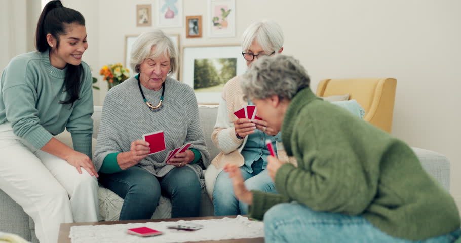 Elderly group, high five and celebration in card game for winning, victory or fun social entertainment at home. Happy senior people enjoying gathering, team activity or games in the living room Royalty-Free Stock Footage #1106925555