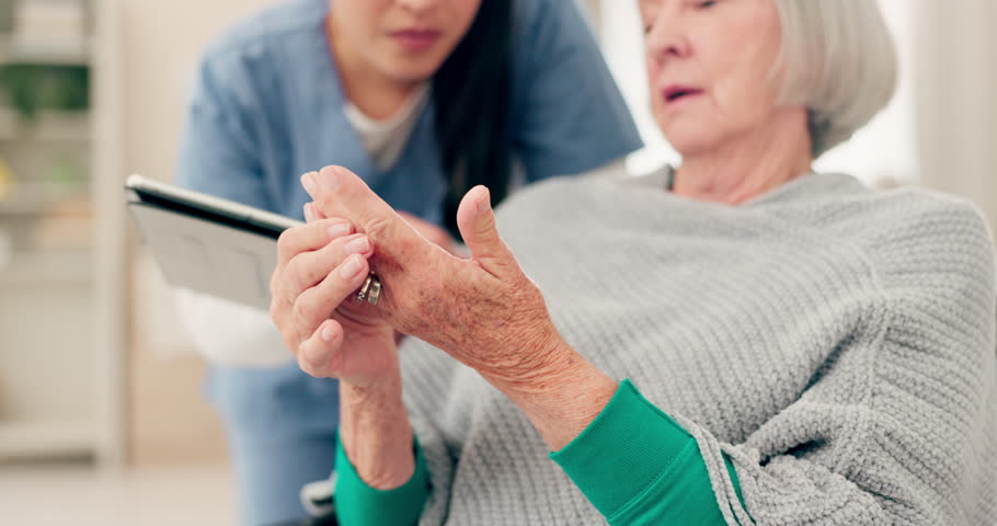 Hands, talking and a woman with a doctor for a consultation, arthritis problem or joint pain. Healthcare, home care and a senior patient speaking to a nurse about a finger accident with notes