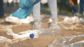 Teamwork.Cleaning plastic garbage in bag on beach in summer.Environmental pollution.Volunteer family clean up plastic waste garbage.Group of people are cleaning up waste garbage together.active people - Powered by Shutterstock - Get 15% off with code: PIKWIZARD15