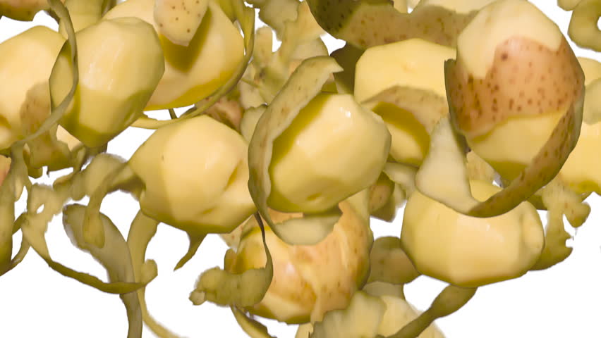 Potatoes and Skins in a Jump on White. Three variants of freshly peeled potato tubers and peels flying up and slowly falling on a white background. Slow Motion