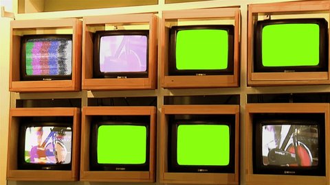 Old TV Pile with Static Noise and Green Screen. You can replace green screen with the footage or picture you want.   – Video có sẵn
