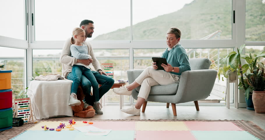 Psychology, talking and father with his girl child in a psychiatry office with a female therapist. Conversation, family discussion and young dad speaking to a psychologist with his kid at a clinic.
