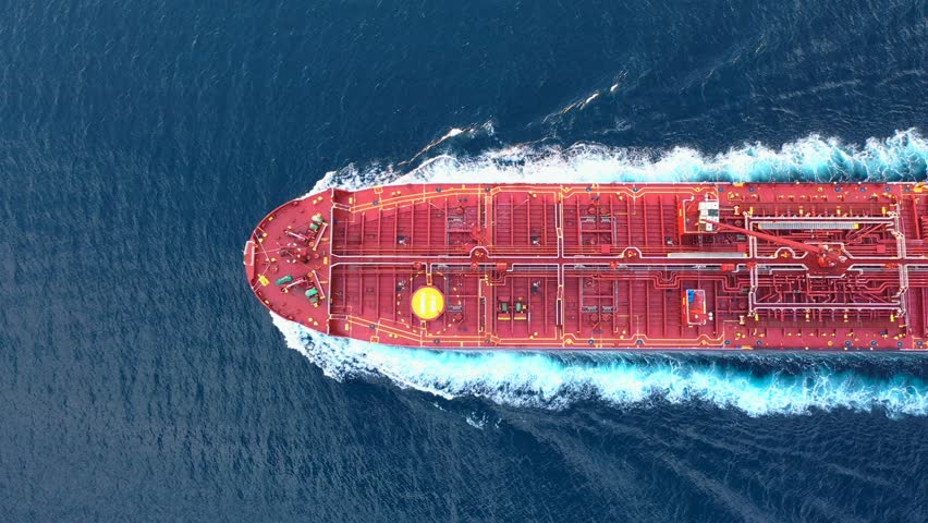 Top-down view of a crude oil tanker speeding through calm waters with trails of foam around her. Powerful diesel engine of the oil tanker roars at full speed and leaves wake water on the Ocean
 Royalty-Free Stock Footage #1106956761