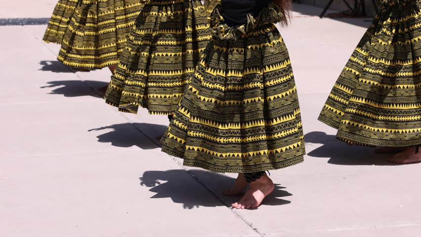 Synchronized hula dance steps with bare feet
