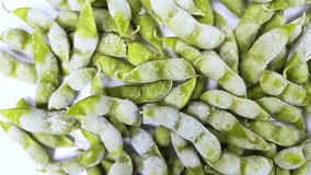 Frozen boiled Edamame (green soybeans) on white background rotating - Powered by Shutterstock - Get 15% off with code: PIKWIZARD15