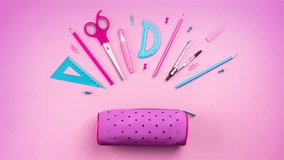 Stop motion SCHOOL animation, school supplies jump out of the pencil case and gather back (pencils, rulers, paper clips, scissors, corrector). 4k video splash screen banner copy space - Powered by Shutterstock - Get 15% off with code: PIKWIZARD15