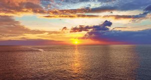 Aerial view of waves sea water surface in sunset or sunrise time, High quality video Bird's eye view,Colorful sea ocean waves in sunset sky background