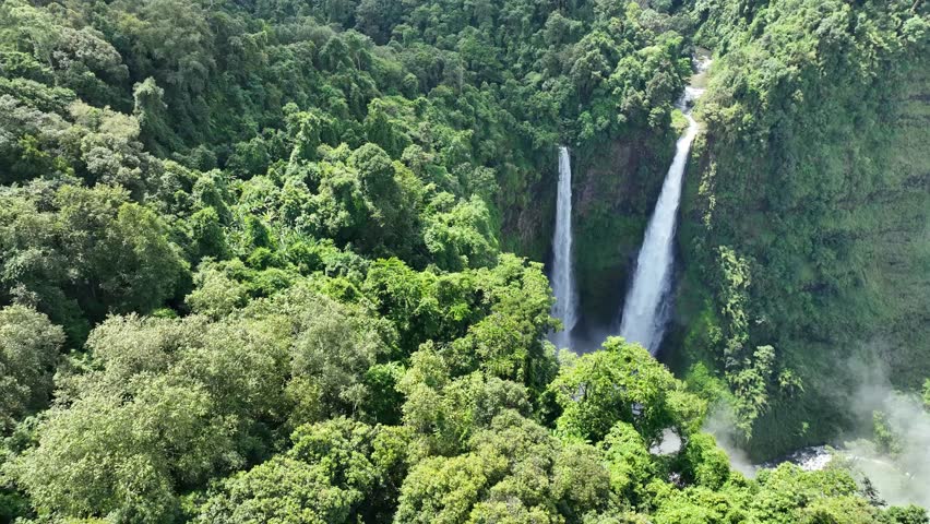The Tad Fane waterfall, on the Bolaven Plateau in Laos, a few kilometers west of Paksong Town, in Champasak Province, within the Dong Houa Sao National Protected Area.bird eye view,aerial view Royalty-Free Stock Footage #1107004853