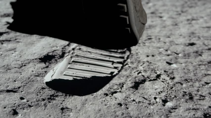 Lunar astronaut walking on the moon's surface and leaves a footprint in the lunar soil. 3d rendering. Some Elements of this video furnished by NASA. Royalty-Free Stock Footage #1107008371