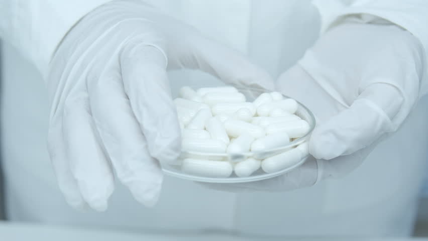 Tablets, capsules and pills. Oral medication. Contain dry, powdered ingredients or miniature pellets. Healthcare and medical. Doctor or physician recommend pills medical prescription. Patient hospital