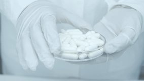 Tablets, capsules and pills. Oral medication. Contain dry, powdered ingredients or miniature pellets. Healthcare and medical. Doctor or physician recommend pills medical prescription. Patient hospital - Powered by Shutterstock - Get 15% off with code: PIKWIZARD15