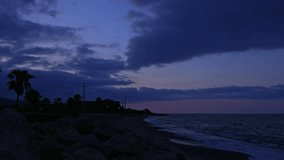 Time lapse captures stoney beach coastline during sun rise