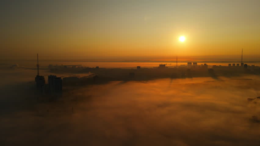  Fog and haze over the city, among the skyscrapers in Russia