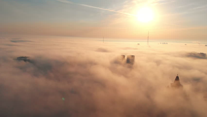  Fog and haze over the city, among the skyscrapers in Russia