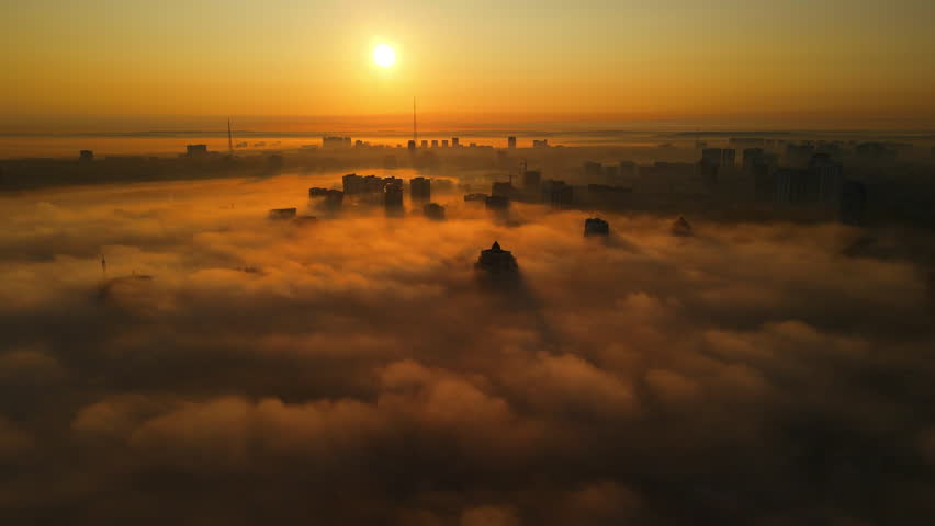  Fog and haze over the city, among the skyscrapers in Russia