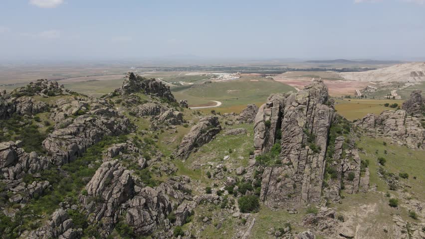 Aerial drone footage: drone turning around the high granite cliffs, Eskişehir, Karakayalar, Turkey, Türkiye, 4k