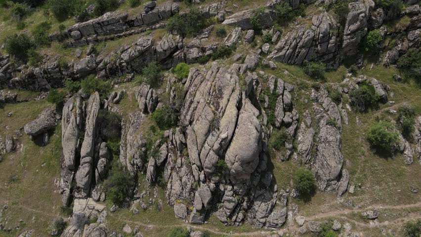 Aerial drone footage: drone circling around the granite cliff, Eskişehir, Karakayalar, Turkey, Türkiye, 4k