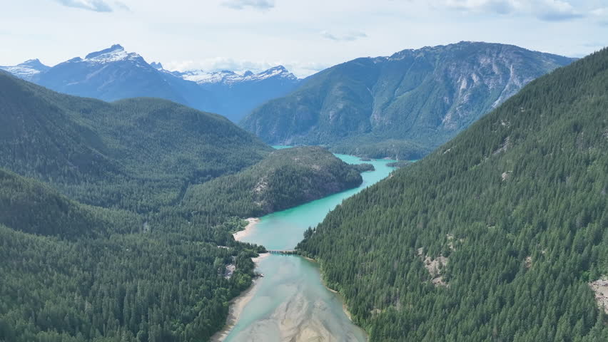 Forest-covered slopes surround scenic Diablo Lake in North Cascades National Park. This mountainous region of northern Washington is absolutely beautiful and easily accessed during summer months.