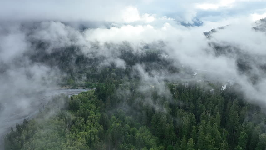 Clouds drift over the Hoh river as it flows through one of the largest temperate rainforests in the U.S. Receiving over 100 inches of rain annually, the Olympic Peninsula is lush with flora and fauna.