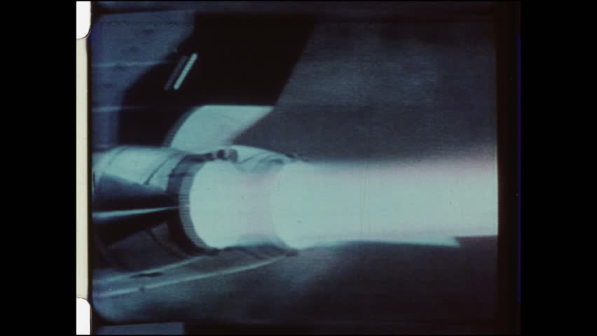 1988 United States. General Dynamics F-16 Fighting Falcon during take off.  Close up of Tailpipe fire, or afterburner. Close up of underbelly with wheels lifted into fuselage. 4K Overscan of film 