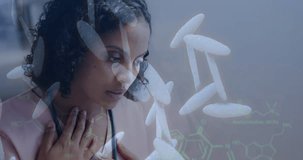 Animation of dna strand and data processing over tired biracial female doctor. Global healthcare, science, medicine, research, computing and data processing concept digitally generated video.