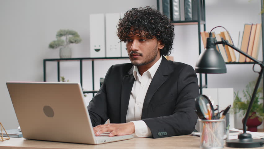 I dont know what to say. Confused business man working on laptop at office workplace. Freelancer feeling embarrassed about ambiguous question, having doubts, no answer idea, being clueless, uncertain Royalty-Free Stock Footage #1107034379
