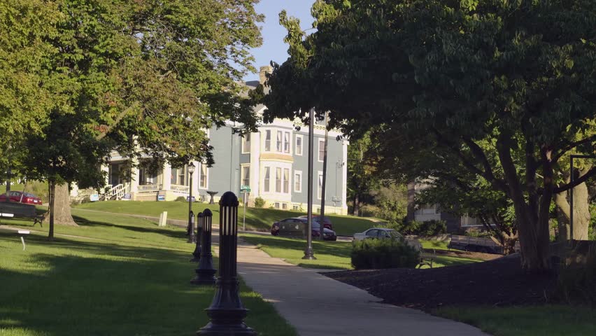 A beautiful green park in Janesville with buildings in the background, Wisconsin, United States