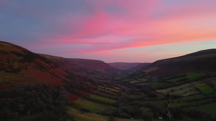 4K Drone video of Sunset at Hay Bluff, Black Mountains, Brecon Beacons National Park, Wales in February. Backwards movement.