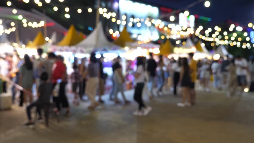 Slow motion of blurred busy busy fresh market full with crowd people walking in street shopping.
Thailand street food night market booth festival light bright bokeh. Royalty-Free Stock Footage #1107046619