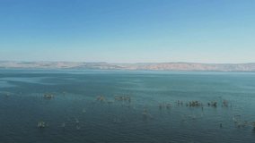 A drone video shot in the Sea of Galilee is a mesmerizing experience that captures the natural beauty and uniqueness of this remarkable body of water. 
