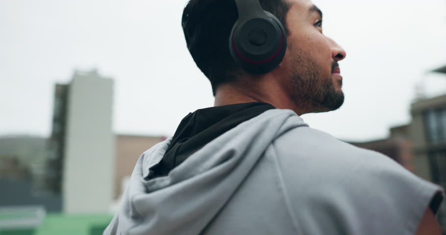 Thinking, fitness and man with music in the city, looking at view or idea for outdoor training. Smile, podcast and a male athlete or runner with headphones for cardio, exercise or plan for a workout
