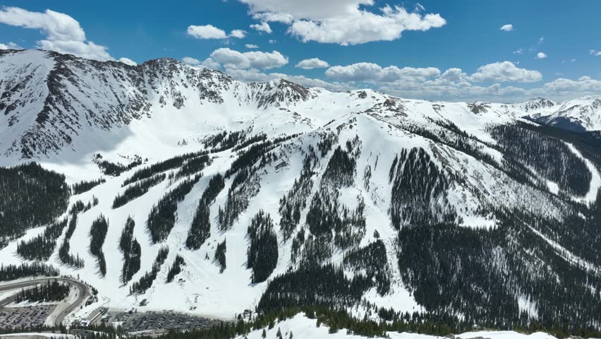 Aerial shot of the snow covered Rocky Mountains near Loveland Pass, Colorado. Royalty-Free Stock Footage #1107063283