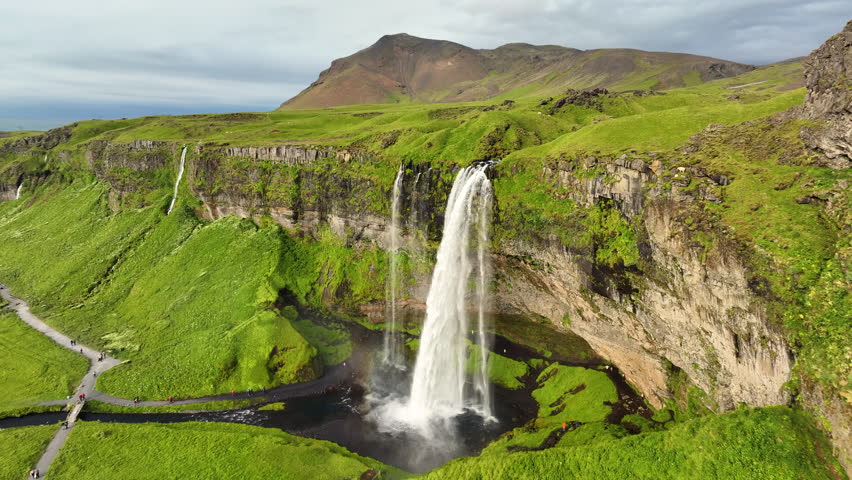 Aerial view of Famous Waterfall Seljalandsfoss In Iceland. Epic Drone Shot Mountain Waterfall. Slow motion shot
