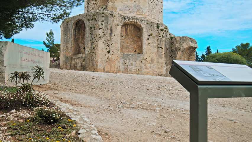 Cultural landmark of Tour Magne in Nimes, France. 18m stone watchtower, part of the Roman city wall from the Augustinian era, with panoramic views.