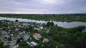 Cityscape of Daugavpils with Daugava river and summer houses.