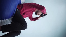 Vertical video of gamer playing on vr headset with video game controller - Powered by Shutterstock - Get 15% off with code: PIKWIZARD15