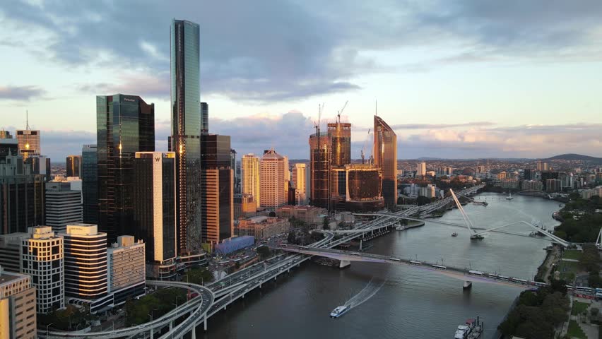 Aerial drone view of Brisbane City, QLD, Australia of the west facing side of the city along Brisbane River and Riverside Expressway looking toward South Brisbane during late afternoon in August 2023  Royalty-Free Stock Footage #1107077605