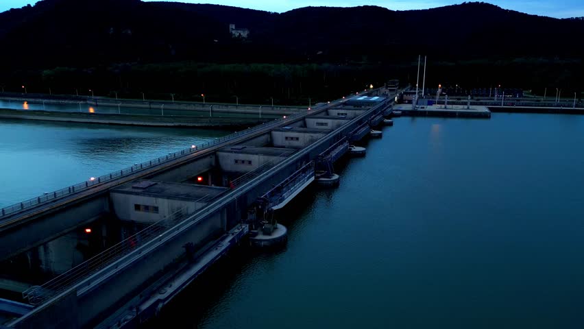Flying Over The Largest Dam Of The Iron Gate I Hydroelectric Power Station Over Danube In Romania. Aerial Drone Shot