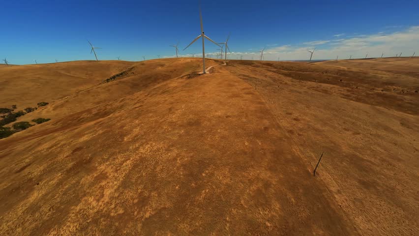 Wind turbines in a field in Australia on a sunny day