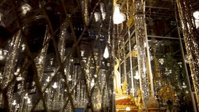 4K video of golden Buddha with 100 meters glass cathedral in Tha Sung temple, Thailand.