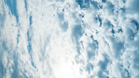 Vertical video. Blue sky with white clouds. Natural atmospheric phenomena of cloud formation. Summer timelapse of fluffy clouds. Sunlight. - Powered by Shutterstock - Get 15% off with code: PIKWIZARD15