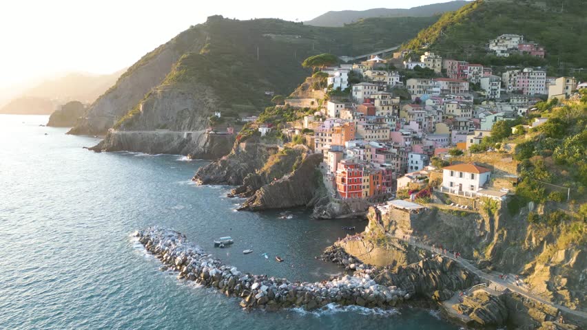 Incredible Aerial View of Cinque Terre Italian Coastline at Sunset. Riomaggiore, Drone. Royalty-Free Stock Footage #1107091279