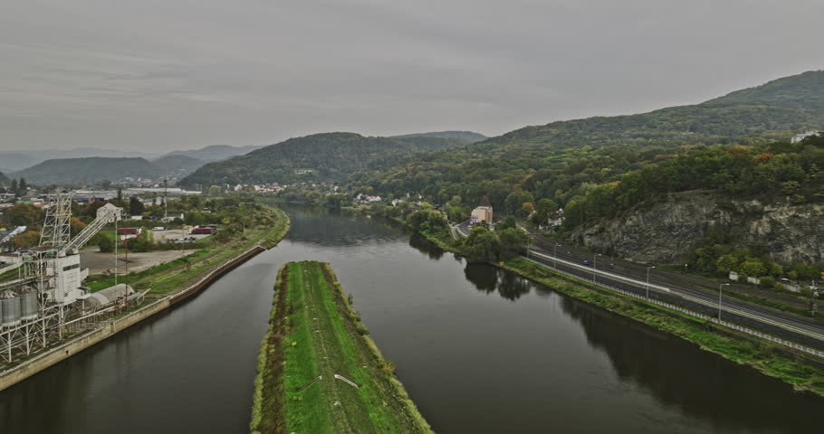 Usti nad Labem Czechia Aerial v1 drone flyover Elbe river channel capturing panoramic views of riverside industrial area, quarry site and hillside cityscape - Shot with Mavic 3 Cine - November 2022